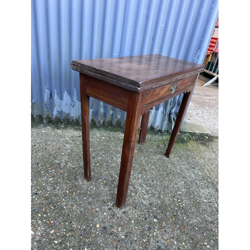 11 - A Georgian mahogany fold over tea table 76x36x75