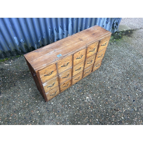 12 - A vintage pine bank of 15 workshop drawers 84x24x20