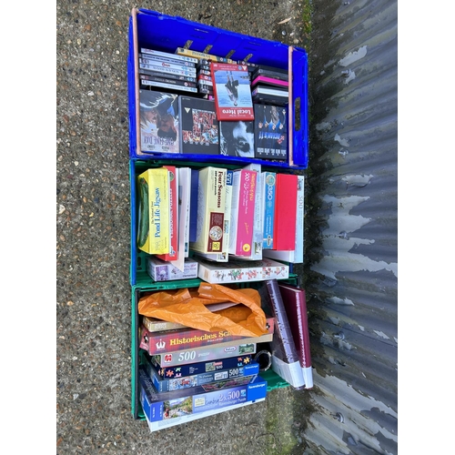 158 - One tray DVDs and two trays puzzles (crates not included )