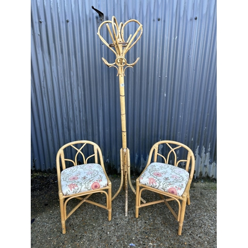 163 - A vintage bamboo hallstand together with two bamboo chairs