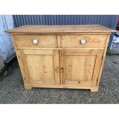 168 - A country pine two drawer sideboard 130x56x98