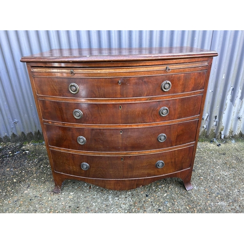 17 - A mahogany bow front Batchelors chest of drawers with brushing slide, early 20th Century 90x55x80
