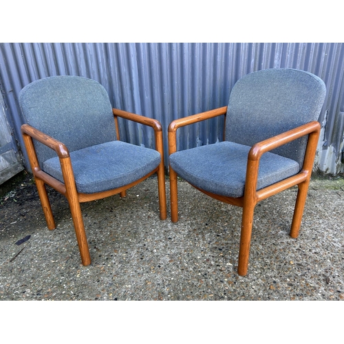 170 - A pair of retro teak framed armchairs by BACO HARVREY