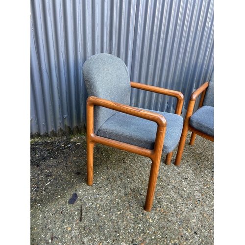 170 - A pair of retro teak framed armchairs by BACO HARVREY