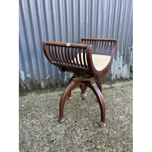 174 - A swivel adjust mahogany piano stool