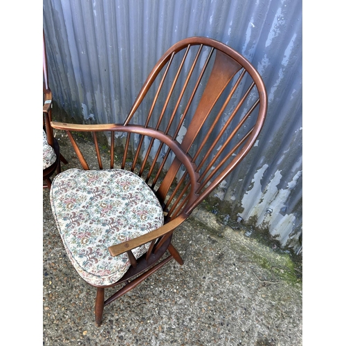 177 - A pair of dark ercol stick back armchairs