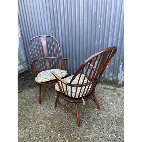177 - A pair of dark ercol stick back armchairs