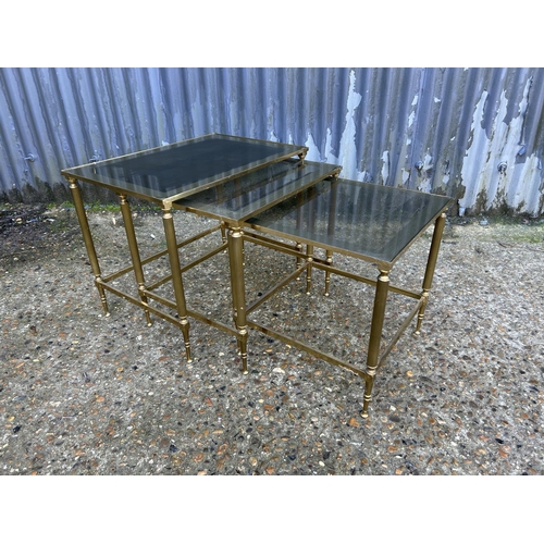 178 - An Italian style brass and glass nest of three tables