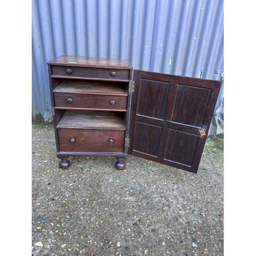 21 - A Victorian hardwood cabinet, single door enclosing 3 fitted drawers 40x32x60