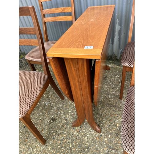 210 - A mid century nathan teak drop leaf table together with four chairs