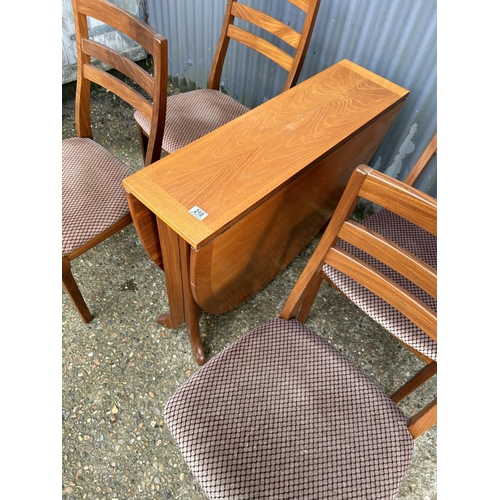 210 - A mid century nathan teak drop leaf table together with four chairs