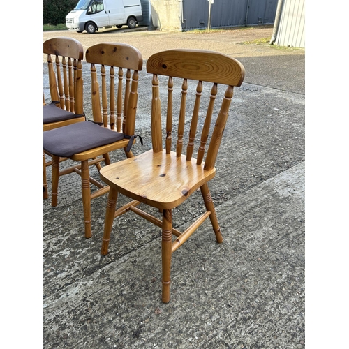 211 - A set of four pine chairs