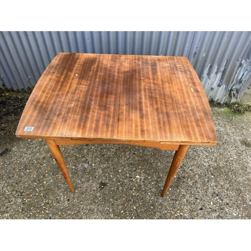 212 - A teak drawer leaf dining table