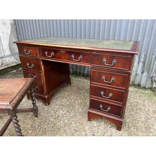 220 - A reproduction mahogany twin pedestal desk together with an oak dining chair