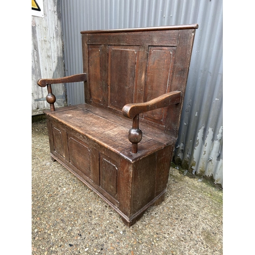 222 - An antique oak monks bench seat 110cm wide