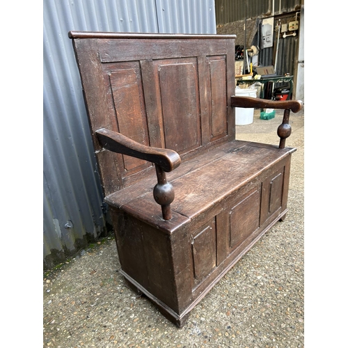 222 - An antique oak monks bench seat 110cm wide