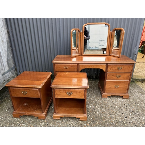 225 - A modern cherrywood effect dressing table together with matching pair of bedside chests