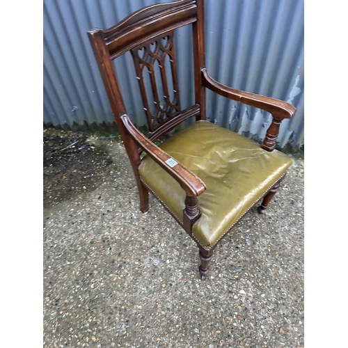 231 - A victorian mahogany carver chair with green leather seat