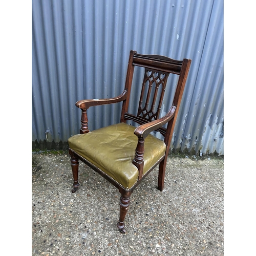 231 - A victorian mahogany carver chair with green leather seat