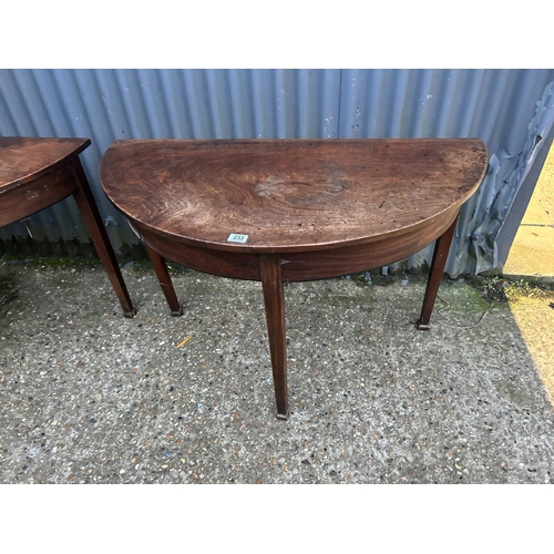 233 - A pair of victorian mahogany demi lune tables joining to create a circular dining table