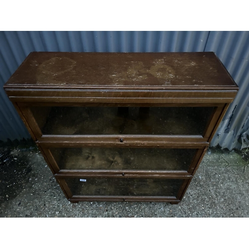 238 - A three section stacking bookcase stamped GLOBE WERNICKE with glazed up and over doors