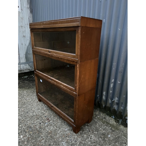 238 - A three section stacking bookcase stamped GLOBE WERNICKE with glazed up and over doors