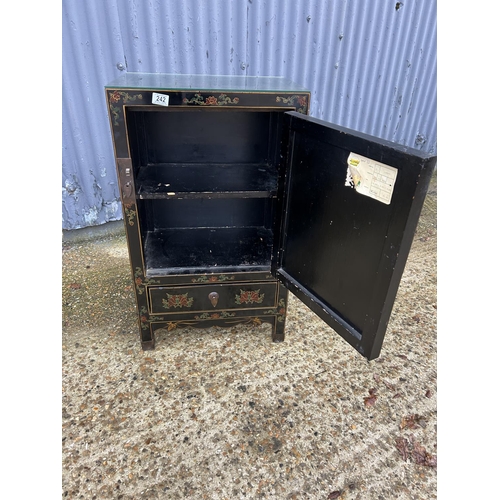 242 - An oriental black laquered single door cupboard 52x34x88