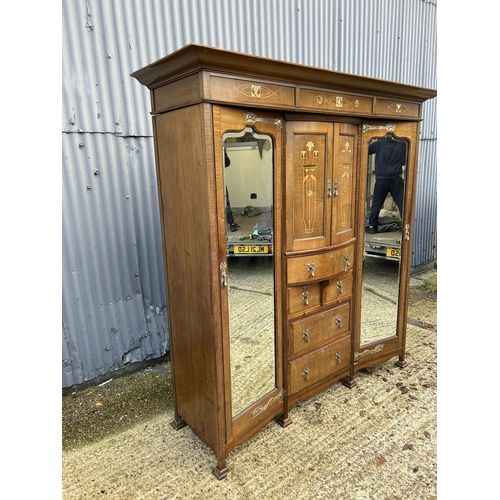 244 - Shapland & Petter, Barnstaple, a triple section walnut wardrobe circa 1900, Art Nouveau inlaid throu... 