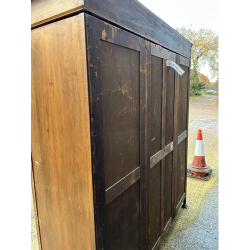 244 - Shapland & Petter, Barnstaple, a triple section walnut wardrobe circa 1900, Art Nouveau inlaid throu... 