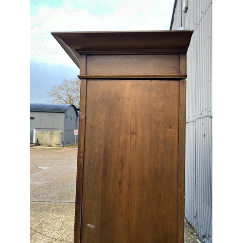 244 - Shapland & Petter, Barnstaple, a triple section walnut wardrobe circa 1900, Art Nouveau inlaid throu... 