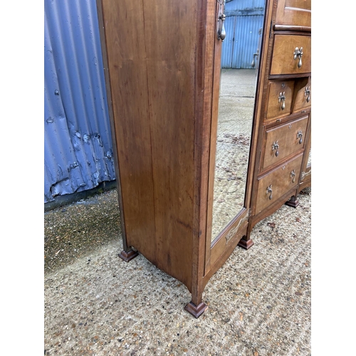 244 - Shapland & Petter, Barnstaple, a triple section walnut wardrobe circa 1900, Art Nouveau inlaid throu... 