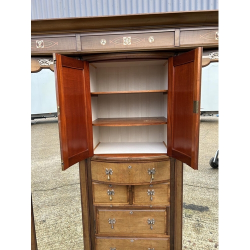 244 - Shapland & Petter, Barnstaple, a triple section walnut wardrobe circa 1900, Art Nouveau inlaid throu... 