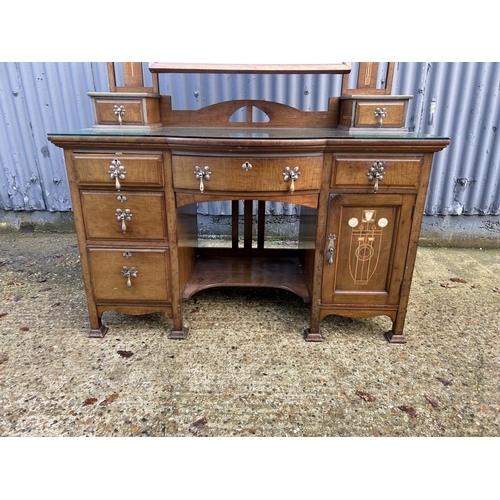 245 - Shapland & Petter, Barnstaple, a walnut kneehole dressing table circa 1900, Art Nouveau inlaid with ... 