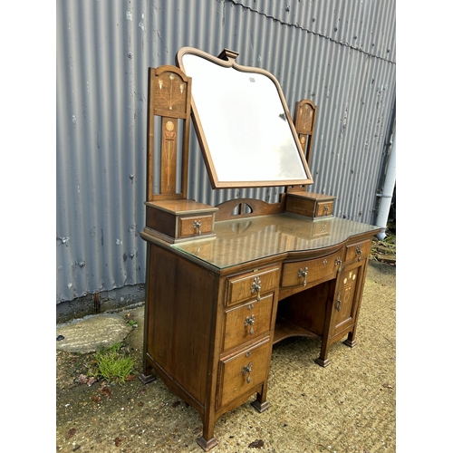 245 - Shapland & Petter, Barnstaple, a walnut kneehole dressing table circa 1900, Art Nouveau inlaid with ... 