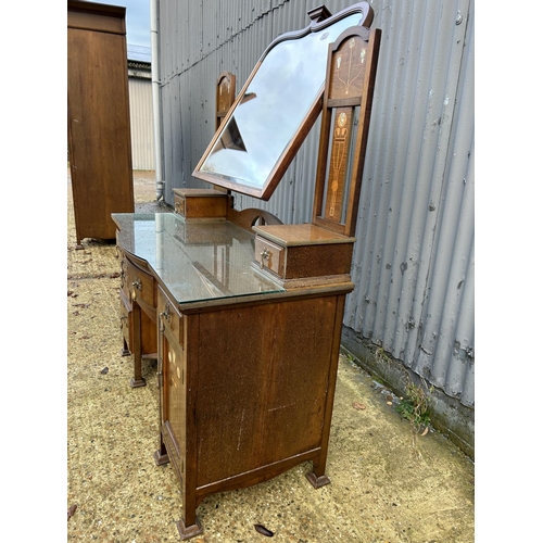 245 - Shapland & Petter, Barnstaple, a walnut kneehole dressing table circa 1900, Art Nouveau inlaid with ... 