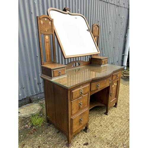 245 - Shapland & Petter, Barnstaple, a walnut kneehole dressing table circa 1900, Art Nouveau inlaid with ... 