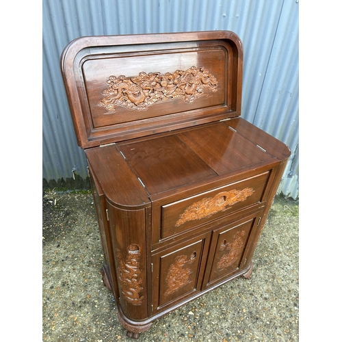 246 - A carved oriental hardwood bar/cocktail cabinet with fold over top 84x40x100