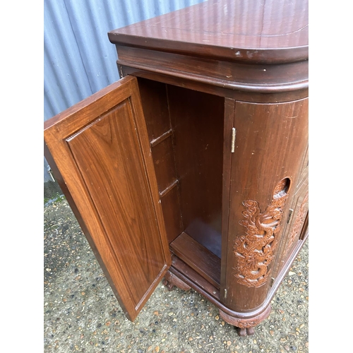 246 - A carved oriental hardwood bar/cocktail cabinet with fold over top 84x40x100