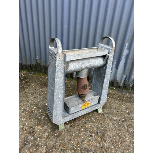 255 - A vintage galvanised greenhouse heater