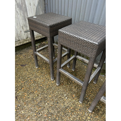 3 - A set of four contemporary grey rattan patio bar stools