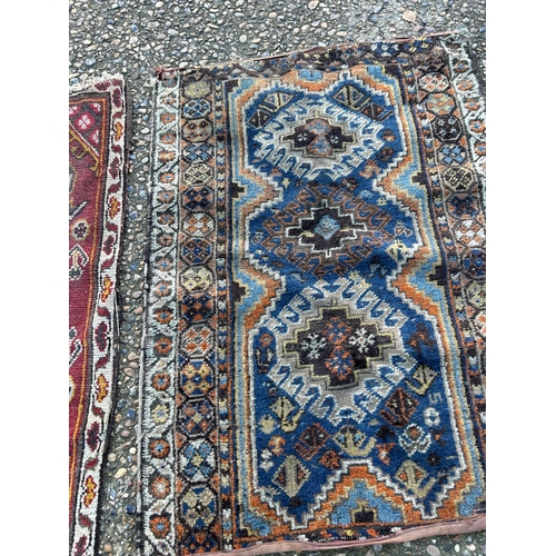 33 - Two small oriental rugs (larger 77x108)