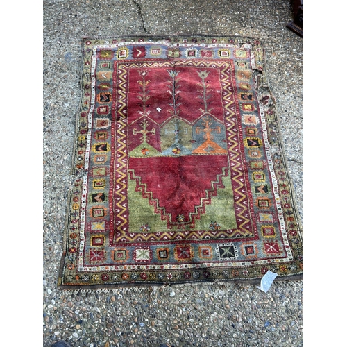 34 - An antique red and gold pattern rug 156x120