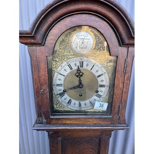 36 - An Oak cased Tempus Fugit longcase clock by WARING & GILLOWS