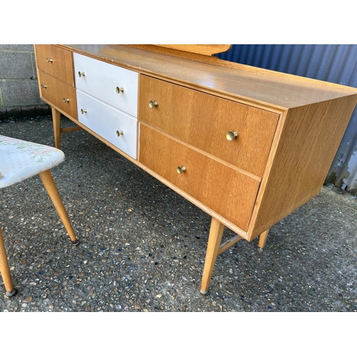 52 - A mid century light oak six drawer dressing table with stool 169x47x69