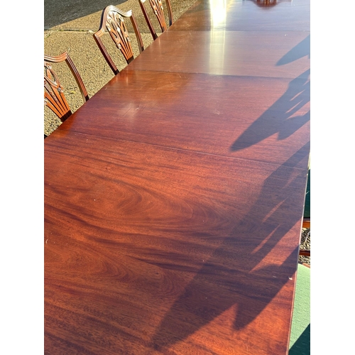 62 - A very large reproduction mahogany twin pedestal dining table with 2 extension leaves, to a max size... 