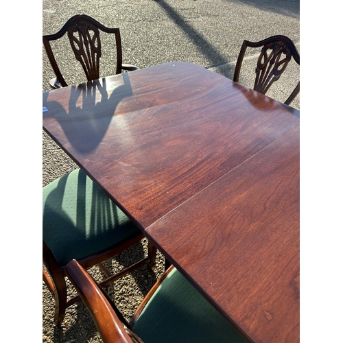 62 - A very large reproduction mahogany twin pedestal dining table with 2 extension leaves, to a max size... 