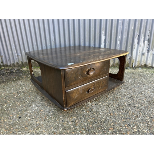63 - An ercol Pandora two drawer coffee table in dark elm