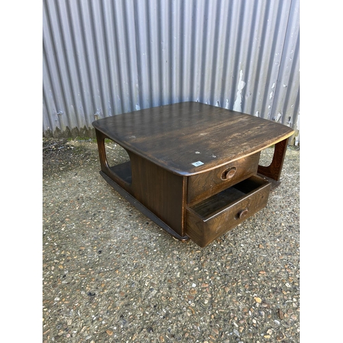 63 - An ercol Pandora two drawer coffee table in dark elm