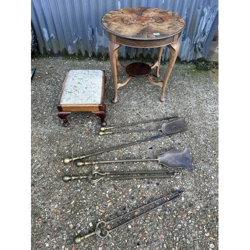 77 - A walnut occasional table, a stool and fire irons
