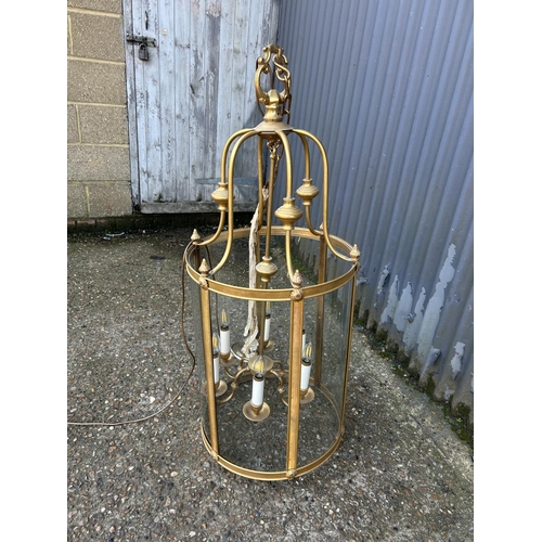 79 - A very large brass pendant lantern fitting 110cm tall